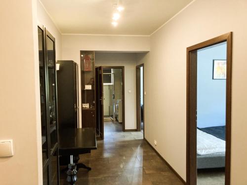 a room with a mirror and a dressing room at Apartment Gdansk Close to Oldtown in Gdańsk