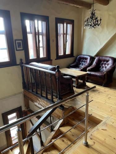 a living room with a couch and a table at Kapteinis in Liepāja