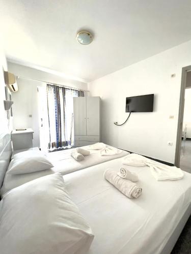 Postel nebo postele na pokoji v ubytování Atrium Apartment #1