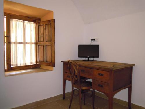 TV a/nebo společenská místnost v ubytování Hostel Cañaveral