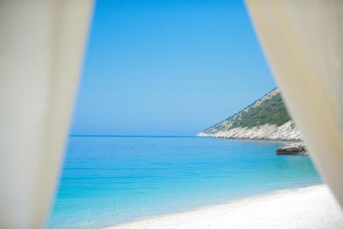 a view of the ocean from a beach at 3-bedroom beach villa with a pool and private sauna in Green Coast Palase in Palasë
