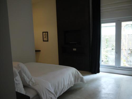 Ein Bett oder Betten in einem Zimmer der Unterkunft Arthur & Paul (Men Only Hotel)