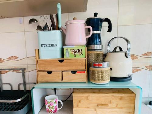 a table with a bunch of items on it at Three bedroom with two terraces for 7people+baby in Kaunas