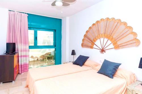 Ένα ή περισσότερα κρεβάτια σε δωμάτιο στο Welcoming apartment in La Vila Joiosa 65 m² with sea view
