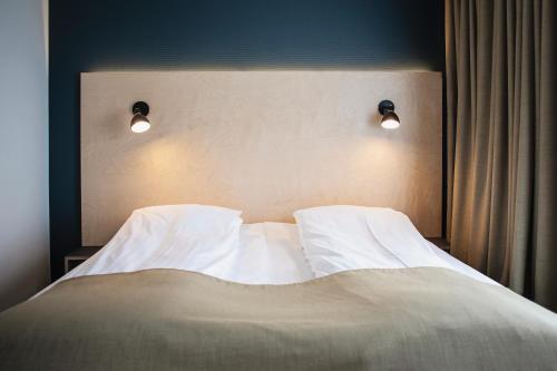 Postel nebo postele na pokoji v ubytování 62N Hotel - City Center