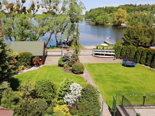 an aerial view of a park with a lake at Go Mazury in Mrągowo