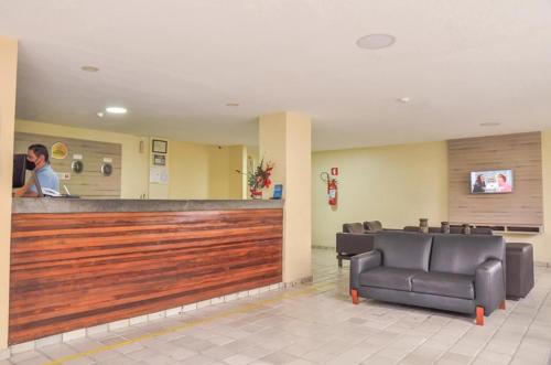 TV a/nebo společenská místnost v ubytování Lagoa Mar Inn - Estacionamento e duas crianças de até 10 anos Será Free