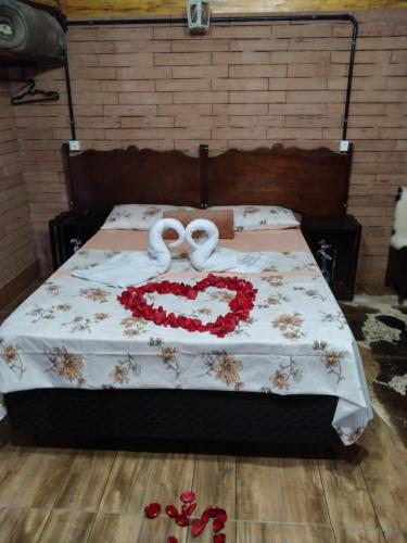 Katil atau katil-katil dalam bilik di Sossego do Interior III