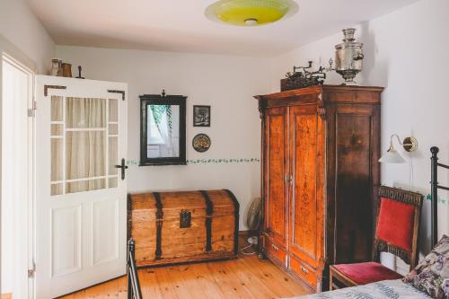 a room with a wooden chest next to a door at Villa Irbe in Jūrmala