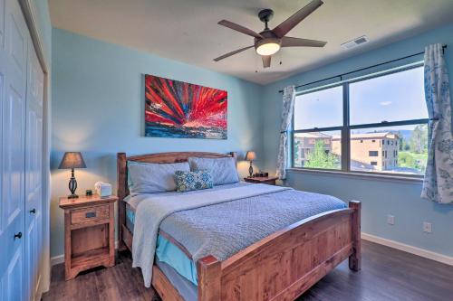 a bedroom with a bed with a ceiling fan and a window at Stunning Fraser Condo Less Than 8 Mi to Winter Park! in Fraser