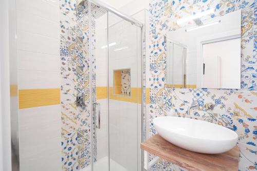 a bathroom with a sink and a shower at Toto e Peppino Luxury Rooms in Naples