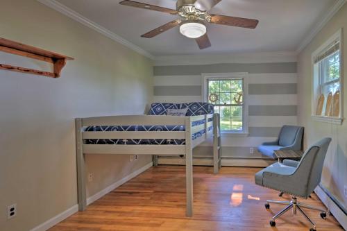 a bedroom with a bunk bed and a ceiling fan at Coastal Edgewater Home with Private Hot Tub! in Annapolis