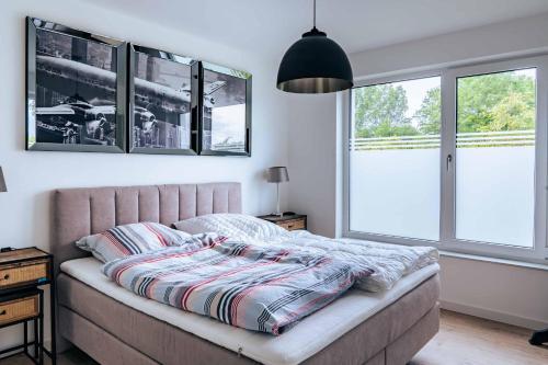 Ένα ή περισσότερα κρεβάτια σε δωμάτιο στο Zweite Heimat Apartment 2