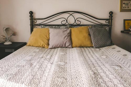 a bed with two pillows on top of it at Villa Irbe in Jūrmala