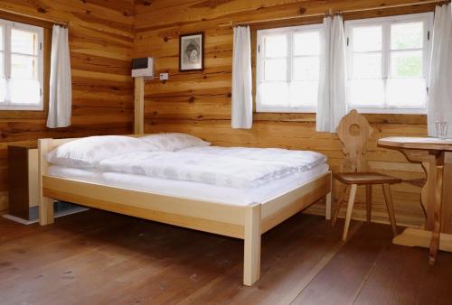 Postel nebo postele na pokoji v ubytování Letní byt ve skanzenu