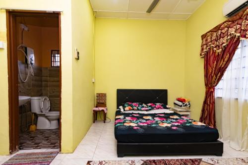 Giường trong phòng chung tại Tamu Nor Homestay Kuantan