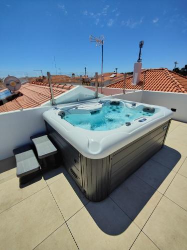 a bath tub sitting on top of a roof at Corkoon - Duna Parque Resorts & Hotels in Vila Nova de Milfontes