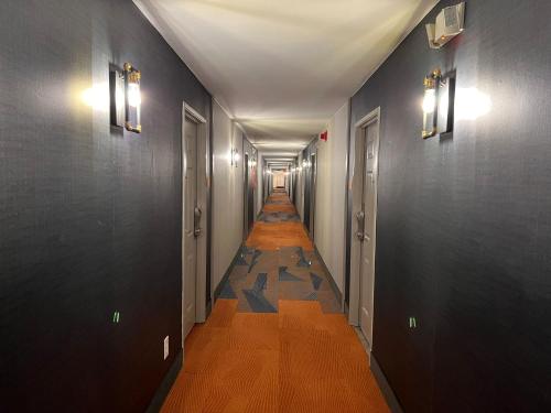 a hallway with a long corridor with a long aisle at La Quinta Inn Lexington-Horse Park in Lexington