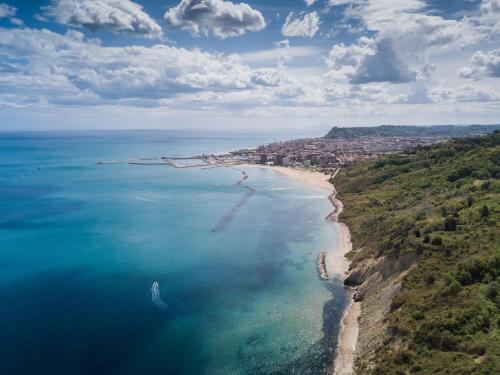 an aerial view of a beach and the ocean at Amadei Hotel Figaro & Apartments in Pesaro