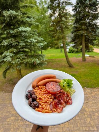 a plate of food with carrots and other vegetables at Resort LUFT Sněžník in Sněžnik