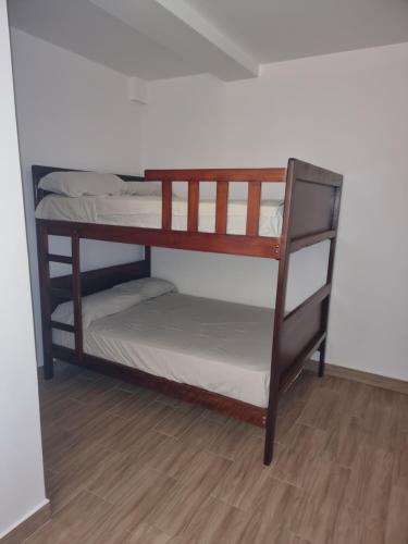 Ένα ή περισσότερα κρεβάτια σε δωμάτιο στο CRUCITALIA Departamento x 10