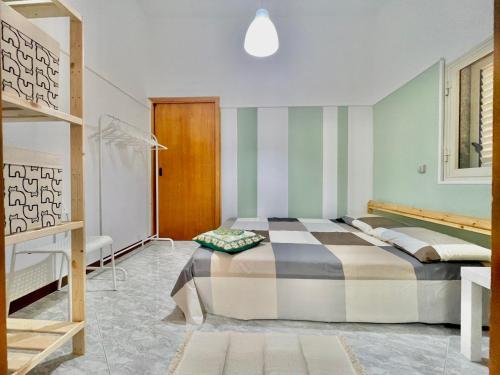 Ένα ή περισσότερα κρεβάτια σε δωμάτιο στο Casa vacanze “U Cavaleri “