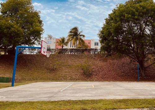 a basketball court with a net on top of a wall at La Costa View in Ceiba