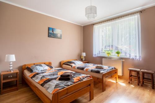 Posteľ alebo postele v izbe v ubytovaní Apartament Grażyna