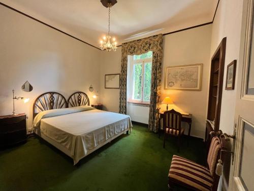 a bedroom with a bed and a window at Resort Villa San Luca CITR8031 in Imperia