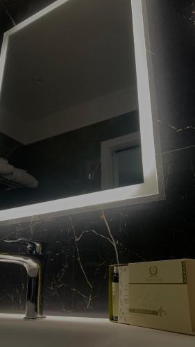 a bathroom sink with a mirror above a sink at Hotel Ristorante Aeclanum in Mirabella Eclano