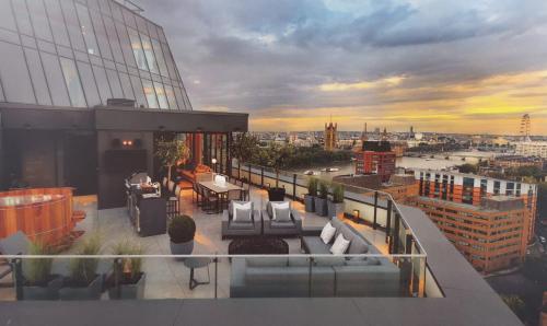 a balcony of a building with a view of a city at Parliament House - Luxury Penthouse in London