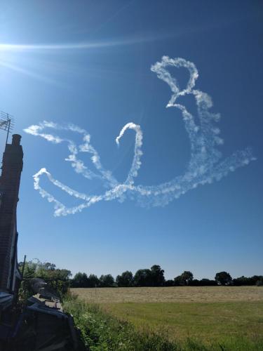 a heart shaped cloud formation in the sky at Littleholme in Potter Heigham