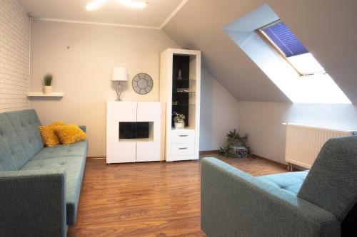 Svetainės erdvė apgyvendinimo įstaigoje Apartament Tyniecki