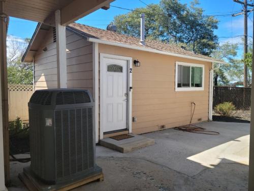 a small house with a trash can in front of it at Adorable studio in Vallejo in Vallejo
