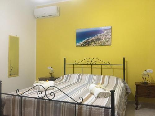 Ένα ή περισσότερα κρεβάτια σε δωμάτιο στο La casa di Nonna Anna