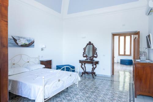 Giường trong phòng chung tại Emerald's Resort - Filomena