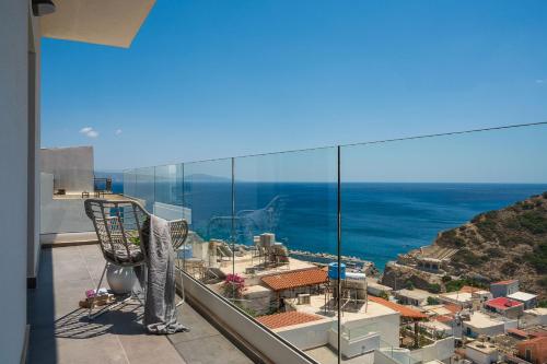 a view of the ocean from the balcony of a building at Stella Luxury Apartments in Agia Galini