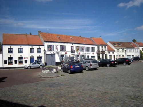 a group of buildings with cars parked in a parking lot at Gardenhouse 'The Block' - Ostend - private garden - IR cabine - AC in Ostend