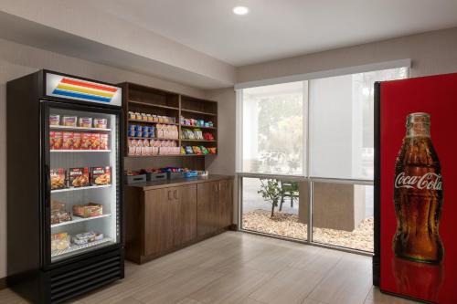 a cocacola soda refrigerator in a room at Holiday Inn Express Vero Beach-West I-95 by IHG in Vero Beach