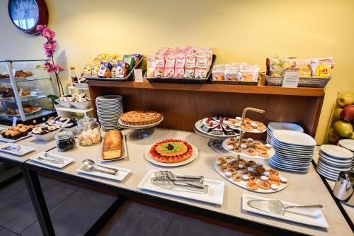 a table with many different types of food on it at Lido International in Desenzano del Garda