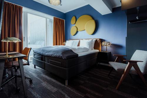 Een bed of bedden in een kamer bij Hotel Hafnia