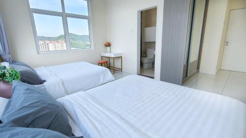 a hospital room with two beds and a window at No.16 The Nordic @ Opposite Puchong IOI Mall in Puchong