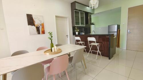 a kitchen and dining room with a table and chairs at No.16 The Nordic @ Opposite Puchong IOI Mall in Puchong