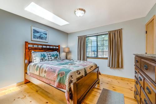 a bedroom with a bed and a window at Carroll Cabin in Tahoma