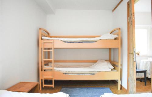 a room with two bunk beds in a room at Lovely Apartment In Tjörnarp With Sauna in Tjörnarp