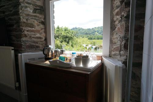 a counter in a room with a window at Lake View Country House in Grasmere