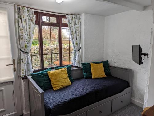 a bench in a room with a window at Lake View Country House in Grasmere