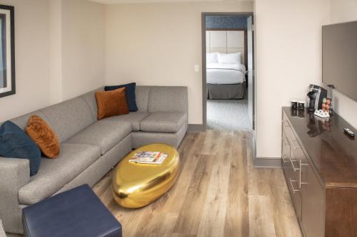 a living room with a couch and a bed at Haywood Park Hotel, an Ascend Collection Hotel in Asheville