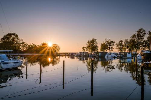 a sunset over a marina with boats in the water at Marina Martinshafen in Sassnitz