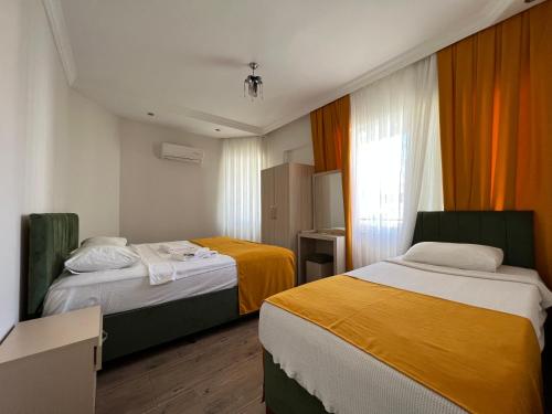 Кровать или кровати в номере Alanya Queen Apart Otel